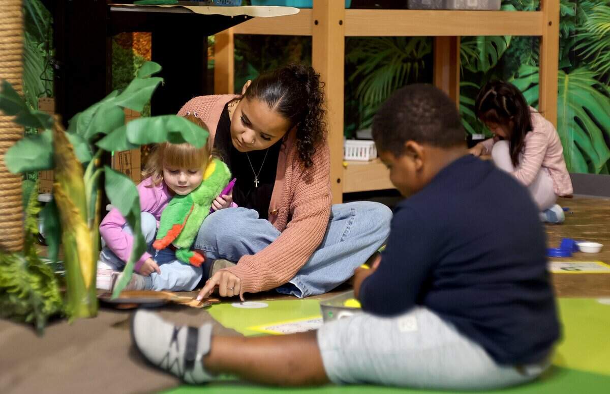 Brynley Cowan, 17, a senior at Ben Barber Innovation Academy, helps pre-K students interact at their stations while interning at Jandrucko Early Learners Academy on Thursday, Nov. 6, 2025.
